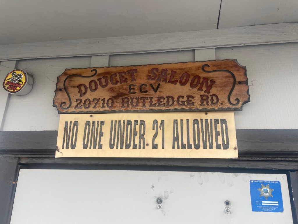 Doucet Saloon Castro Valley, CA, door sign