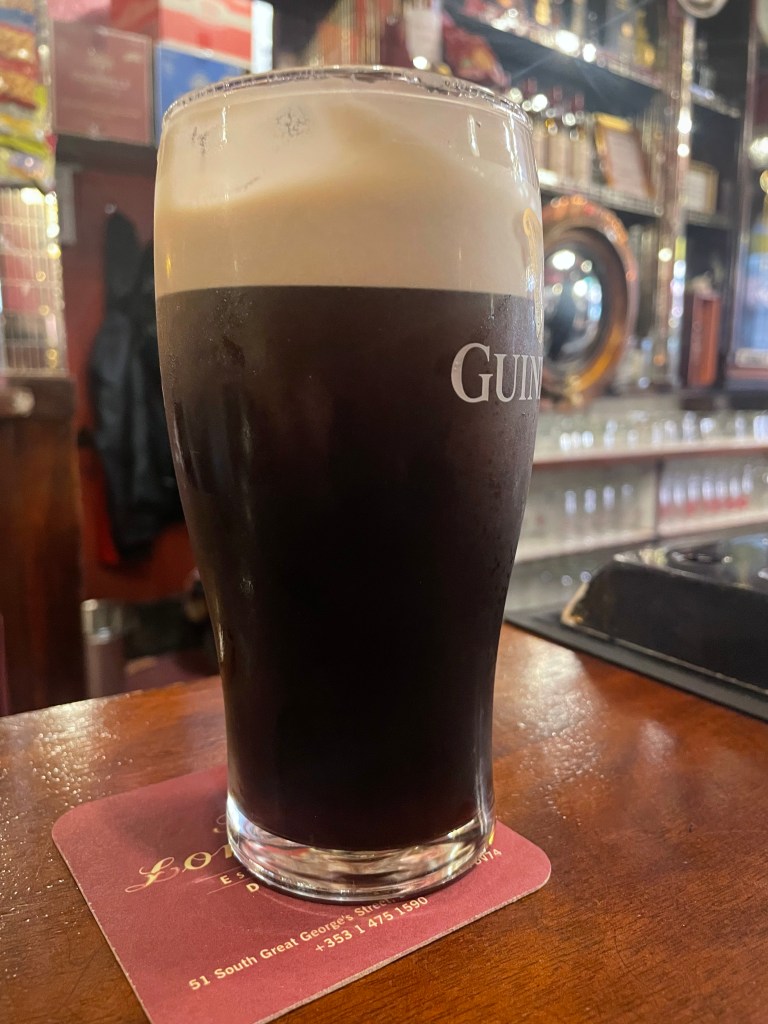 photo of pint of Guiness at The Long Hall pub in Dublin, Ireland